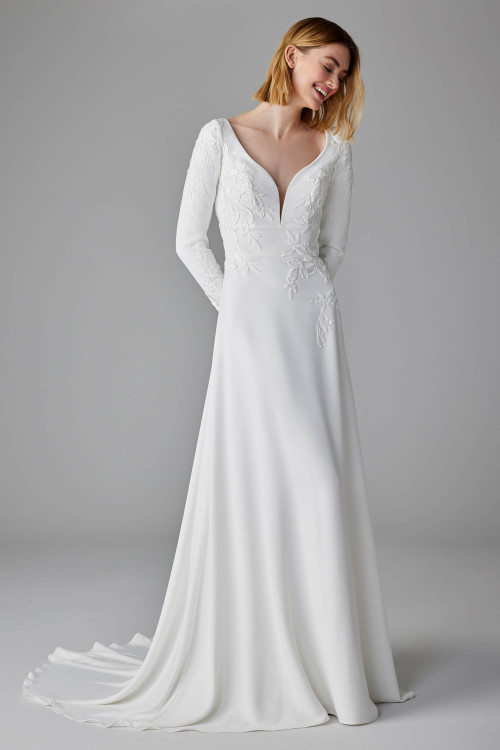 Romantic embroidery elevate this long-sleeve crepe gown with timeless grace Romantic embroidery elevate this long-sleeve crepe gown with timeless grace