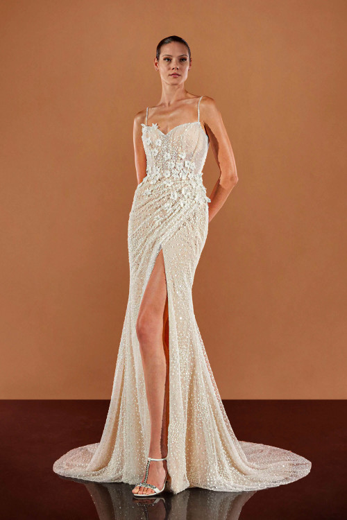 Fitted beaded gown stuns with 3D florals, a sculpted bodice, and a daring thigh-high slit Fitted beaded gown stuns with 3D florals, a sculpted bodice, and a daring thigh-high slit