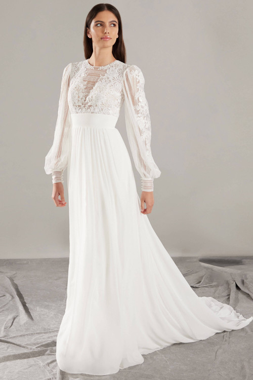 Romantic lace sleeves and a softly gathered skirt create timeless, ethereal bridal elegance Romantic lace sleeves and a softly gathered skirt create timeless, ethereal bridal elegance