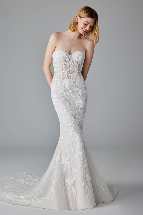 Strapless fit-and-flare gown dazzles with sheer corset bodice and romantic floral beading throughout Strapless fit-and-flare gown dazzles with sheer corset bodice and romantic floral beading throughout