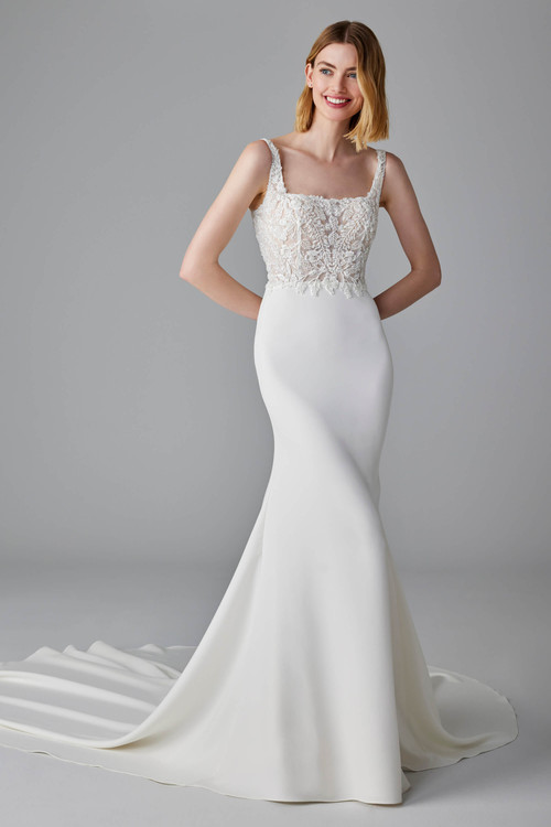 Sleek crepe gown with a sheer floral corset bodice and curve-skimming silhouette for modern romance Sleek crepe gown with a sheer floral corset bodice and curve-skimming silhouette for modern romance