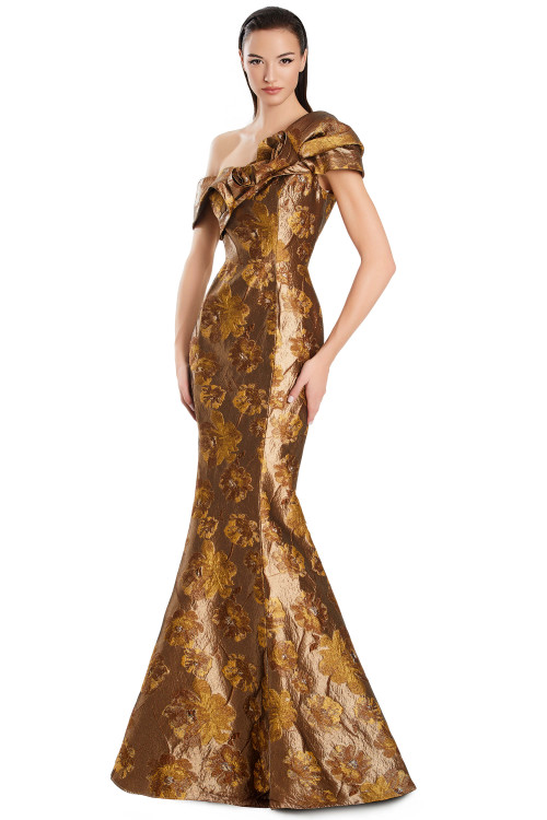 Floral brocade gown with asymmetrical off-shoulder neckline and mermaid silhouette. Floral brocade gown with asymmetrical off-shoulder neckline and mermaid silhouette.