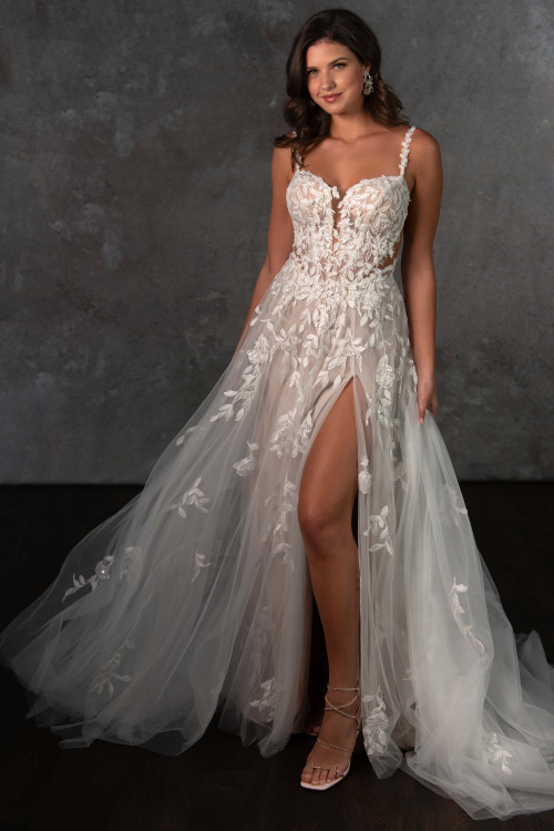 Floral lace blooms over sheer tulle, while a bold slit adds sultry movement and allure Floral lace blooms over sheer tulle, while a bold slit adds sultry movement and allure