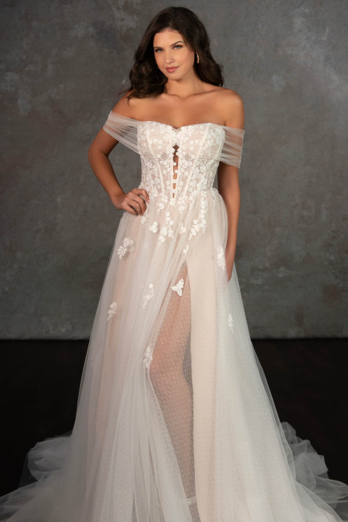 Sheer tulle detachable off-shoulder sleeves and floral appliqués soften this daring corset gown with thigh-high slit with a removeable overskirt Sheer tulle detachable off-shoulder sleeves and floral appliqués soften this daring corset gown with thigh-high slit with a removeable overskirt