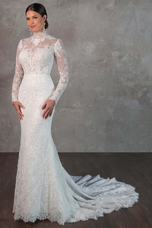 Delicate lace and a high illusion neckline create regal sophistication in this timeless long-sleeve gown Delicate lace and a high illusion neckline create regal sophistication in this timeless long-sleeve gown
