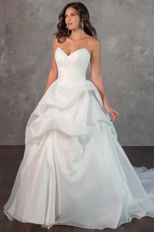 A dreamy ballgown with a ruched bodice and cascading organza layers for a fairytale entrance A dreamy ballgown with a ruched bodice and cascading organza layers for a fairytale entrance