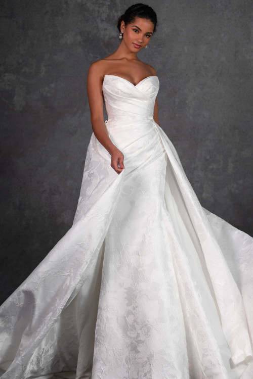 This strapless gown stuns with a ruched bodice and detachable jacquard skirt layered in floral texture This strapless gown stuns with a ruched bodice and detachable jacquard skirt layered in floral texture