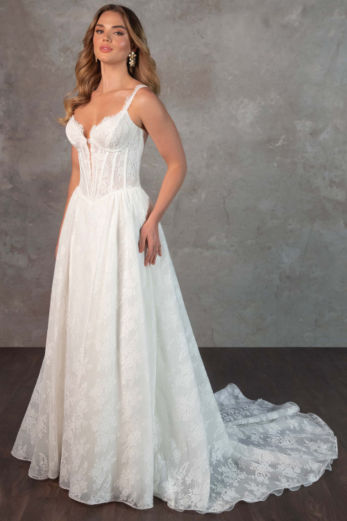 Romantic lace meets modern structure in this sheer corset bodice gown with a dreamy flowing train Romantic lace meets modern structure in this sheer corset bodice gown with a dreamy flowing train