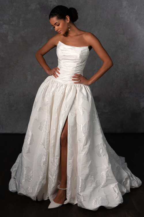 Textured jacquard blooms across this strapless gown, complete with a ruched bodice and sultry slit Textured jacquard blooms across this strapless gown, complete with a ruched bodice and sultry slit