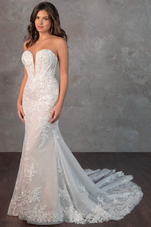 This curve-hugging gown features a plunging strapless neckline, shimmering lace, and a breathtaking chapel train This curve-hugging gown features a plunging strapless neckline, shimmering lace, and a breathtaking chapel train