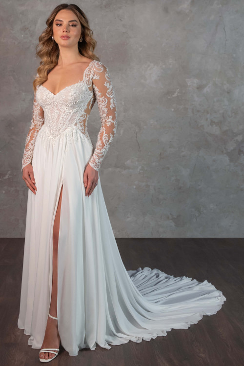 This romantic gown features illusion lace sleeves, a beaded bodice, and a soft chiffon skirt with slit This romantic gown features illusion lace sleeves, a beaded bodice, and a soft chiffon skirt with slit
