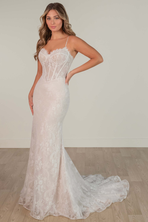 Lace fit-and-flare wedding dress with beaded straps and corset bodice. Lace fit-and-flare wedding dress with beaded straps and corset bodice.