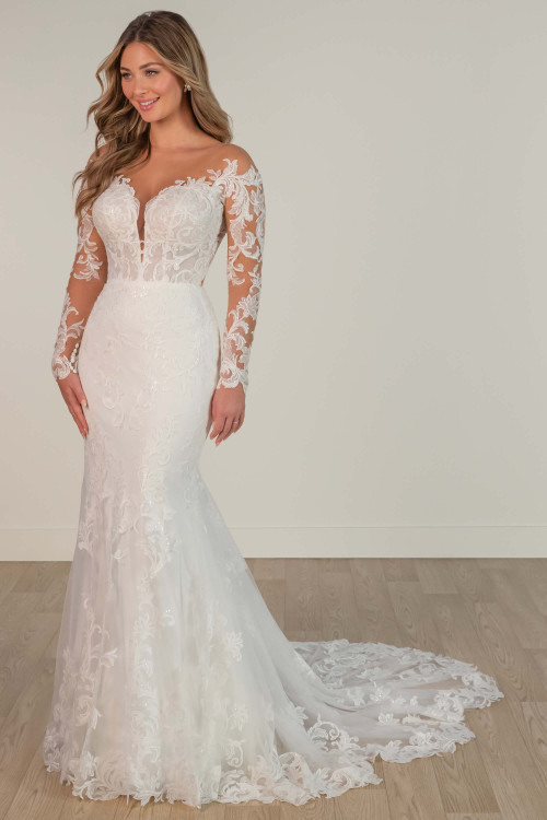 Luxurious long-sleeve wedding dress with intricate lace appliqués and dramatic train. Luxurious long-sleeve wedding dress with intricate lace appliqués and dramatic train.