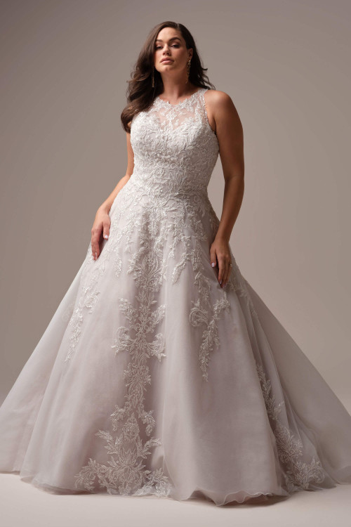 Plus size A-line gown with illusion lace halter, deep V-neck, and sequined lace motifs on sparkle tulle. Plus size A-line gown with illusion lace halter, deep V-neck, and sequined lace motifs on sparkle tulle.