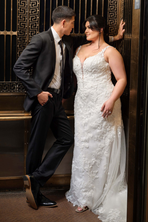 Plus-size bride wearing the Maggie Sottero Zeta A-line gown with a romantic sweetheart neckline and sequin lace. Plus-size bride wearing the Maggie Sottero Zeta A-line gown with a romantic sweetheart neckline and sequin lace.