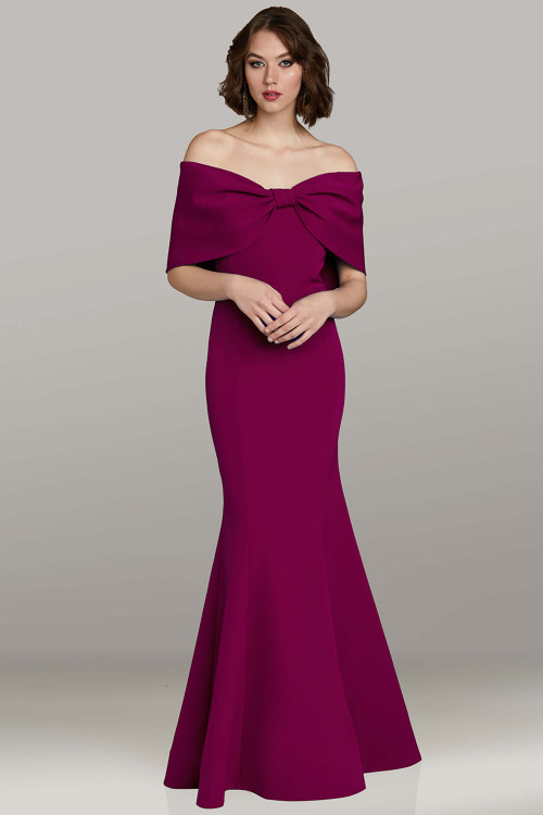 Feriani 12470 fuchsia crepe gown with fit-and-flare silhouette and off-shoulder bow neckline Feriani 12470 fuchsia crepe gown with fit-and-flare silhouette and off-shoulder bow neckline