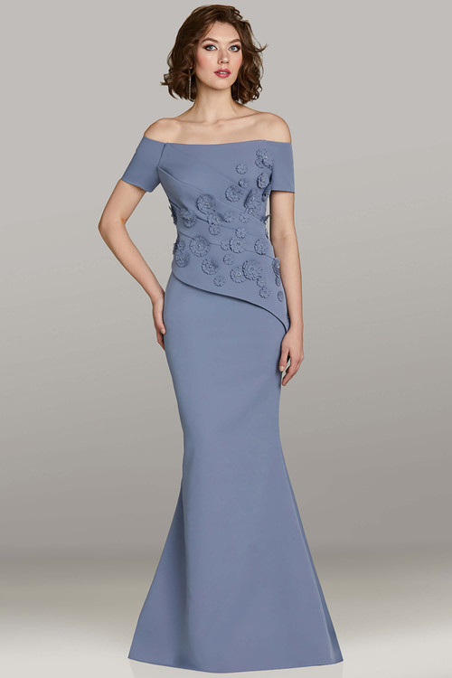 Feriani 18477 Venice blue crepe gown with off-shoulder neckline and rosette bodice detail Feriani 18477 Venice blue crepe gown with off-shoulder neckline and rosette bodice detail