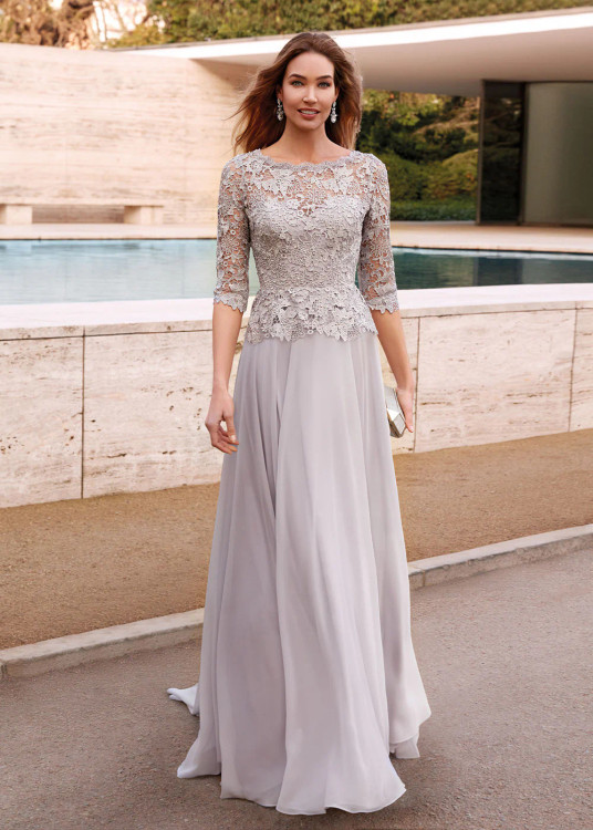 Front view of Alyce Paris MOB gown 27470 in Silver featuring illusion bateau neckline, lace peplum, and flowy chiffon A‑line skirt Front view of Alyce Paris MOB gown 27470 in Silver featuring illusion bateau neckline, lace peplum, and flowy chiffon A‑line skirt