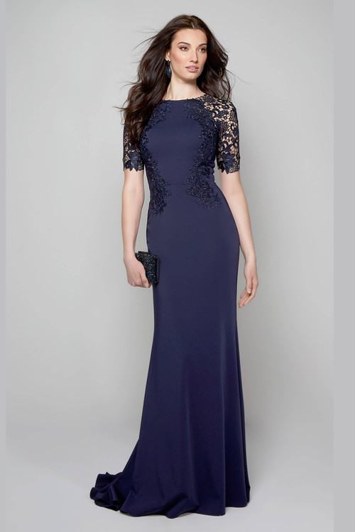 Front view of fitted navy gown with 3/4 lace sleeves and crepe skirt Front view of fitted navy gown with 3/4 lace sleeves and crepe skirt