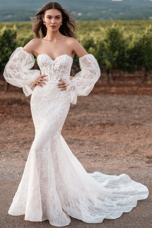 Allure Bridals A1310 gown front—lace fit-and-flare with sweetheart neckline, sheer corset bodice, and detachable puff sleeves. Allure Bridals A1310 gown front—lace fit-and-flare with sweetheart neckline, sheer corset bodice, and detachable puff sleeves.