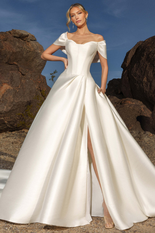 Front view of Kitty Chen Anya ballgown with cat-eye neckline, off-the-shoulder wrap, and high slit Front view of Kitty Chen Anya ballgown with cat-eye neckline, off-the-shoulder wrap, and high slit