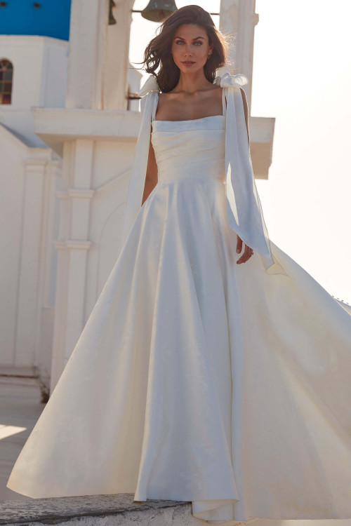 Front view of Fallon by Madison James, satin A-line gown with detachable bow straps and square neckline Front view of Fallon by Madison James, satin A-line gown with detachable bow straps and square neckline