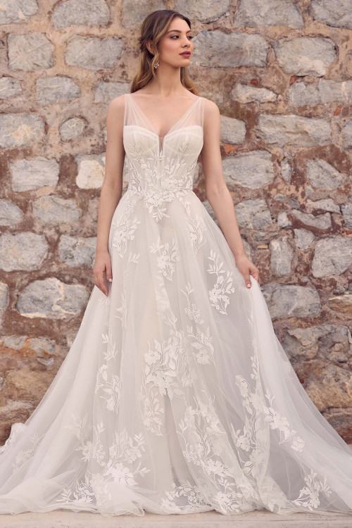 Full front view of Sophia Tolli Y3193, an A-line lace and tulle gown with sheer V-neck bodice, floral appliqués, and flowing skirt Full front view of Sophia Tolli Y3193, an A-line lace and tulle gown with sheer V-neck bodice, floral appliqués, and flowing skirt