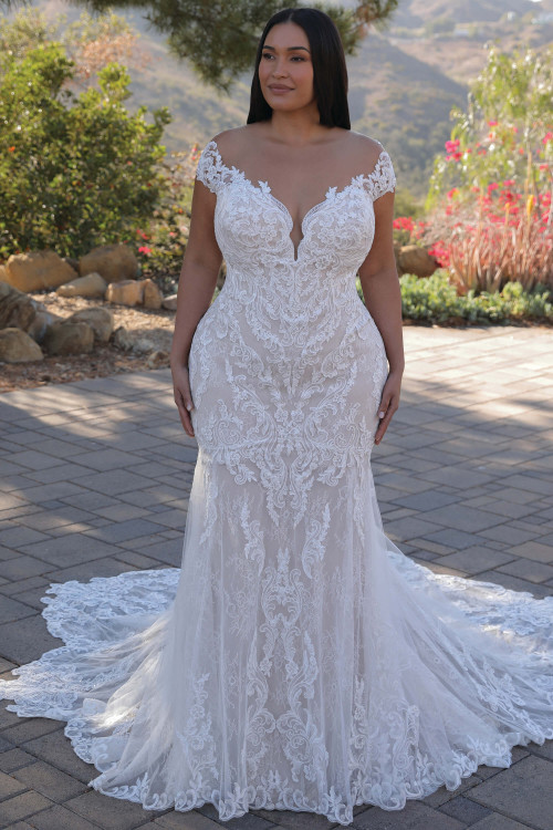 Front view of the Portrait by Enzoani Helene plus-size fit-and-flare gown with portrait neckline and sparkling baroque lace. Front view of the Portrait by Enzoani Helene plus-size fit-and-flare gown with portrait neckline and sparkling baroque lace.