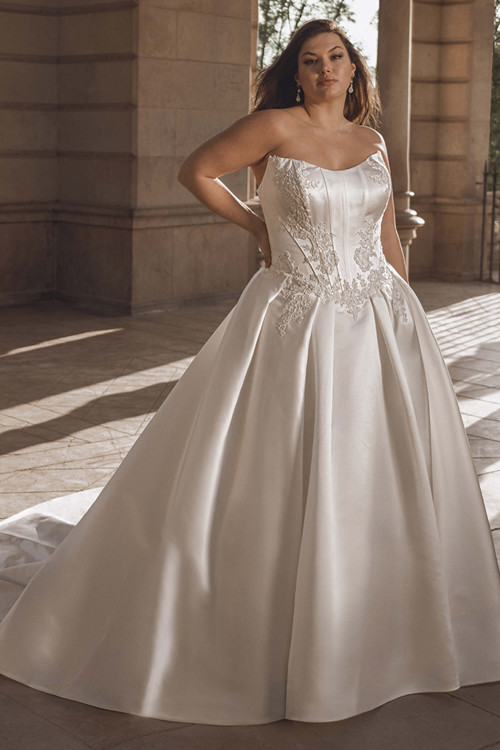 Front view of the Portrait by Enzoani Geneva satin ballgown with scoop neckline and lace-detailed bodice. Front view of the Portrait by Enzoani Geneva satin ballgown with scoop neckline and lace-detailed bodice.
