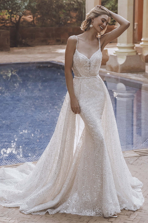 Bride in Enzoani Unice gown with detachable overskirt and Chantilly lace bodice. Bride in Enzoani Unice gown with detachable overskirt and Chantilly lace bodice.