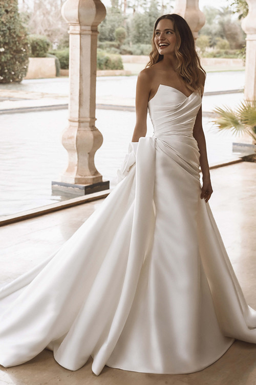 Front view of Enzoani Valencia ballgown with sweetheart neckline and draped bodice. Front view of Enzoani Valencia ballgown with sweetheart neckline and draped bodice.