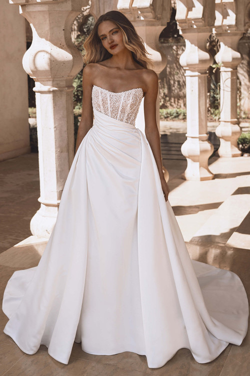 Front view of Enzoani Viola gown with beaded bodice and mikado overskirt. Front view of Enzoani Viola gown with beaded bodice and mikado overskirt.