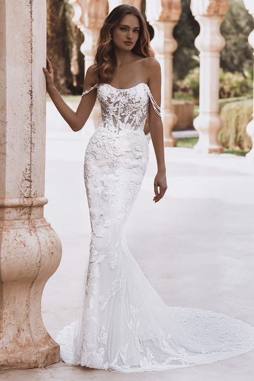 Front view of Enzoani Violet fit-and-flare wedding gown with sweetheart neckline and lace details. Front view of Enzoani Violet fit-and-flare wedding gown with sweetheart neckline and lace details.