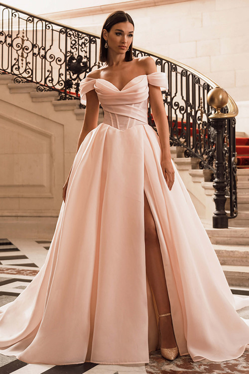 Front view of the ÉLYSÉE Filippa ballgown in blush with draped sweetheart neckline, high slit, and organza skirt. Front view of the ÉLYSÉE Filippa ballgown in blush with draped sweetheart neckline, high slit, and organza skirt.