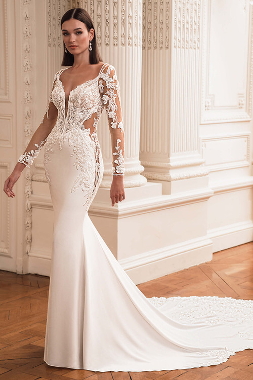 Front view of the ÉLYSÉE Flora fit-and-flare gown with deep V-neckline, illusion cut-outs, and detachable long sleeves. Front view of the ÉLYSÉE Flora fit-and-flare gown with deep V-neckline, illusion cut-outs, and detachable long sleeves.