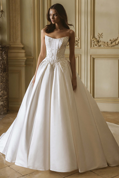 Front view of the ÉLYSÉE Geneva satin ballgown with scoop neckline, corset bodice, and voluminous skirt. Front view of the ÉLYSÉE Geneva satin ballgown with scoop neckline, corset bodice, and voluminous skirt.