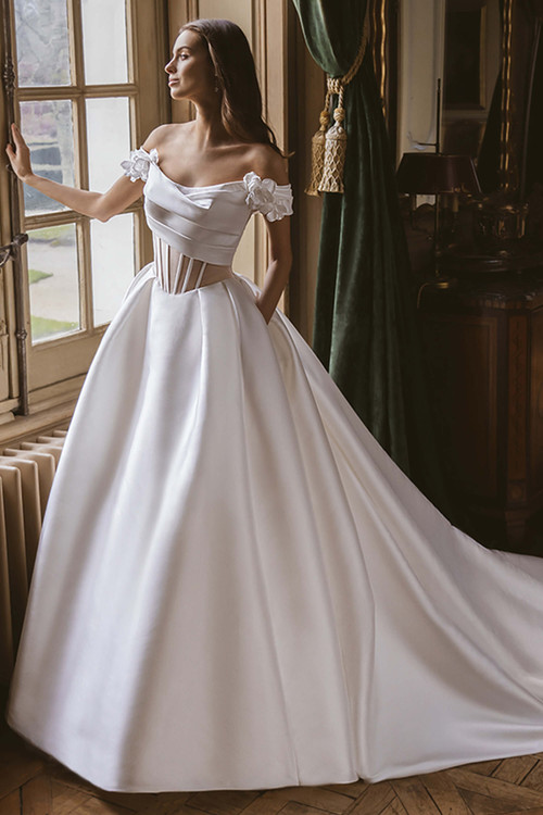 Front view of the ÉLYSÉE Gwendolyn ballgown featuring a scoop neckline, corset bodice, and full satin skirt. Front view of the ÉLYSÉE Gwendolyn ballgown featuring a scoop neckline, corset bodice, and full satin skirt.