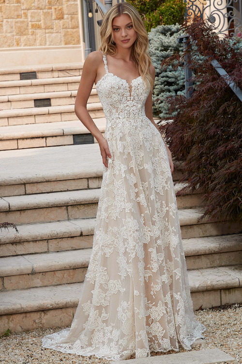 Front view of Morilee Preciosa A-line gown with floral embroidered net. Front view of Morilee Preciosa A-line gown with floral embroidered net.