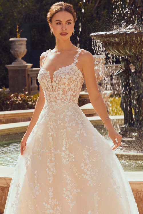 Front view of Morilee Robin ball gown with floral lace appliqués. Front view of Morilee Robin ball gown with floral lace appliqués.