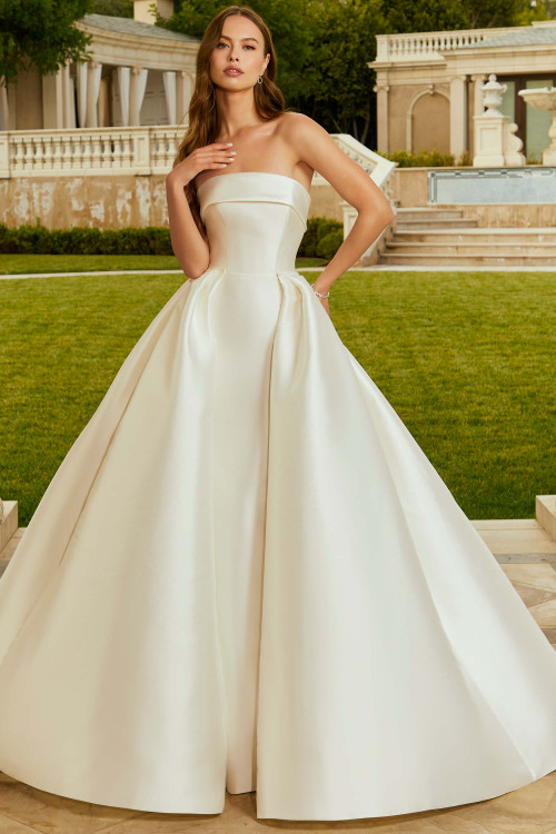 Front view of Morilee Rhonda wedding gown with detachable satin overskirt. Front view of Morilee Rhonda wedding gown with detachable satin overskirt.