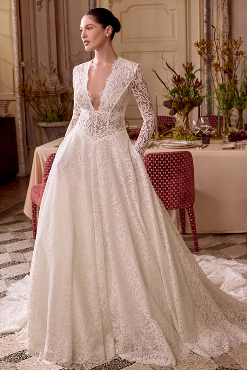 Justin Alexander Lady A-line wedding gown in ivory latte lace with plunging V-neckline and basque waist.