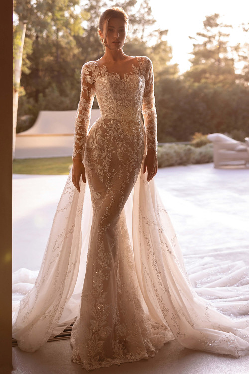 Demetrios Style 1513 flared wedding dress with beaded lace bodice, sheer long sleeves, and softly curved neckline.