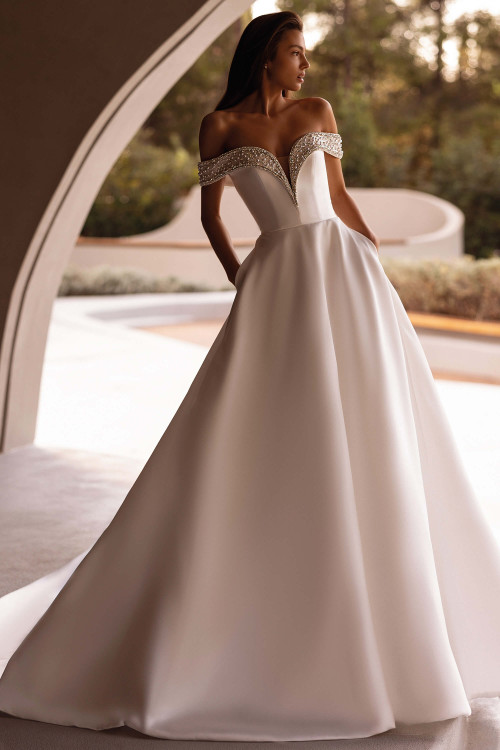 Demetrios Style 1517 ball gown wedding dress with beaded portrait off-the-shoulder neckline and smooth Mikado skirt.