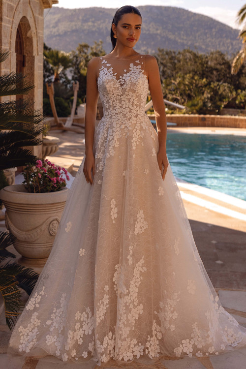 Demetrios 8267 lace A-line gown with illusion neckline and dimensional floral appliqués by poolside, front view