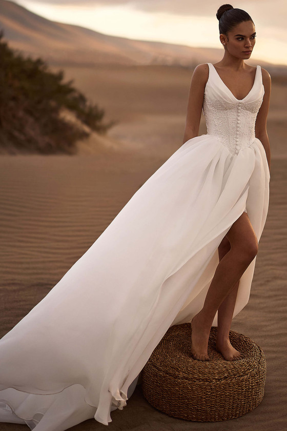 Front view of Milla Nova Rioneth drop-waist organza wedding dress with front slit