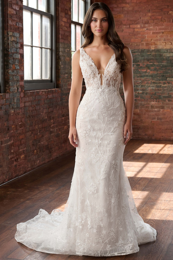 Front view of Christina Wu 15910 beaded lace fit and flare wedding dress with deep V illusion neckline