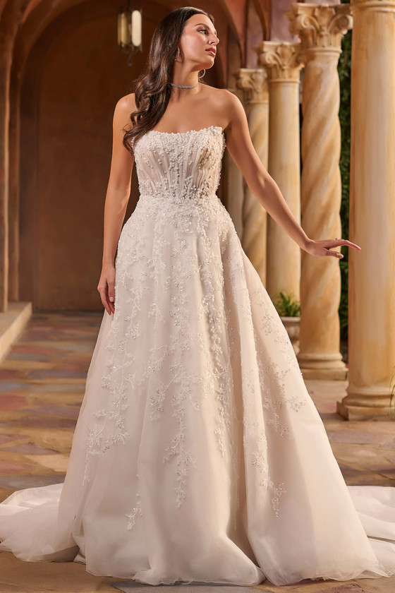 Front view of Christina Wu 15933 A-line wedding dress with peaked strapless neckline