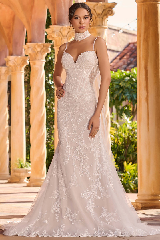 Front view of Christina Wu 15941 beaded lace fit and flare wedding dress with neck scarf