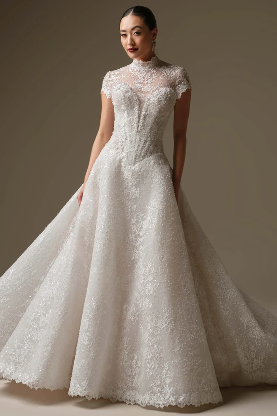 Front view of Sottero and Midgley Angelica beaded lace A-line wedding dress with short sleeve lace jacket