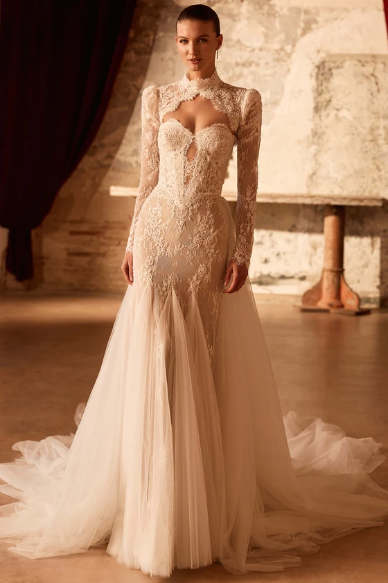 Front view of Pronovias Sagey Chantilly lace mermaid wedding dress with bolero and overskirt